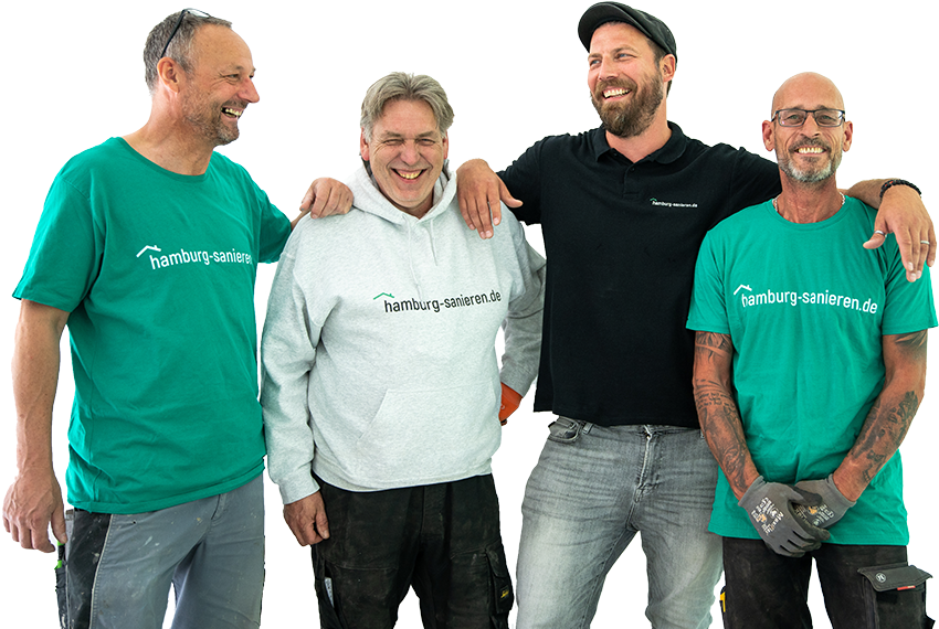 Vier freundliche Handwerker von hamburg-sanieren.de in Arbeitskleidung, lächelnd und posierend als eingespieltes Sanierungsteam.